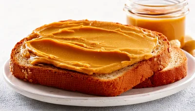 Peanut Butter Spread On Toasted Bread Slice