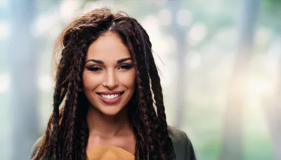 Portrait Of A Smiling Woman With Dreadlocks