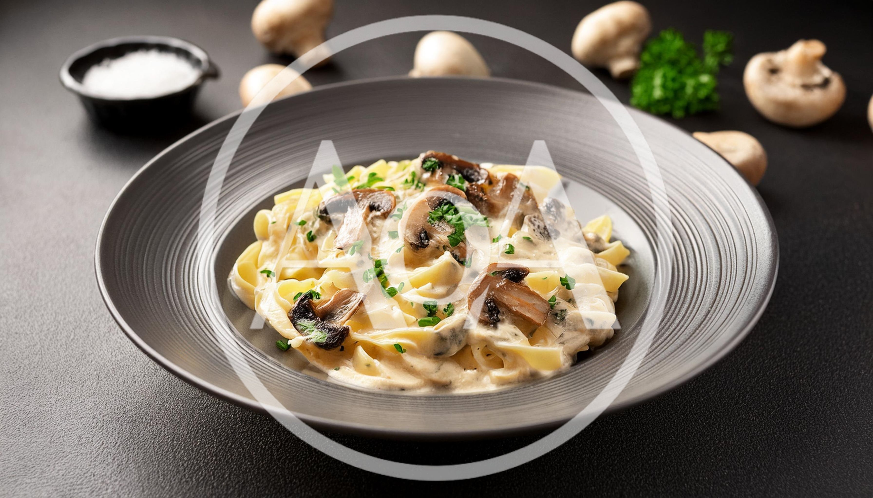 Creamy Mushroom Fettuccine Pasta in a Dark Bowl