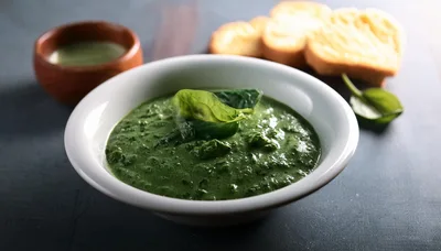 Bowl Of Creamy Spinach Soup With Toasted Bread