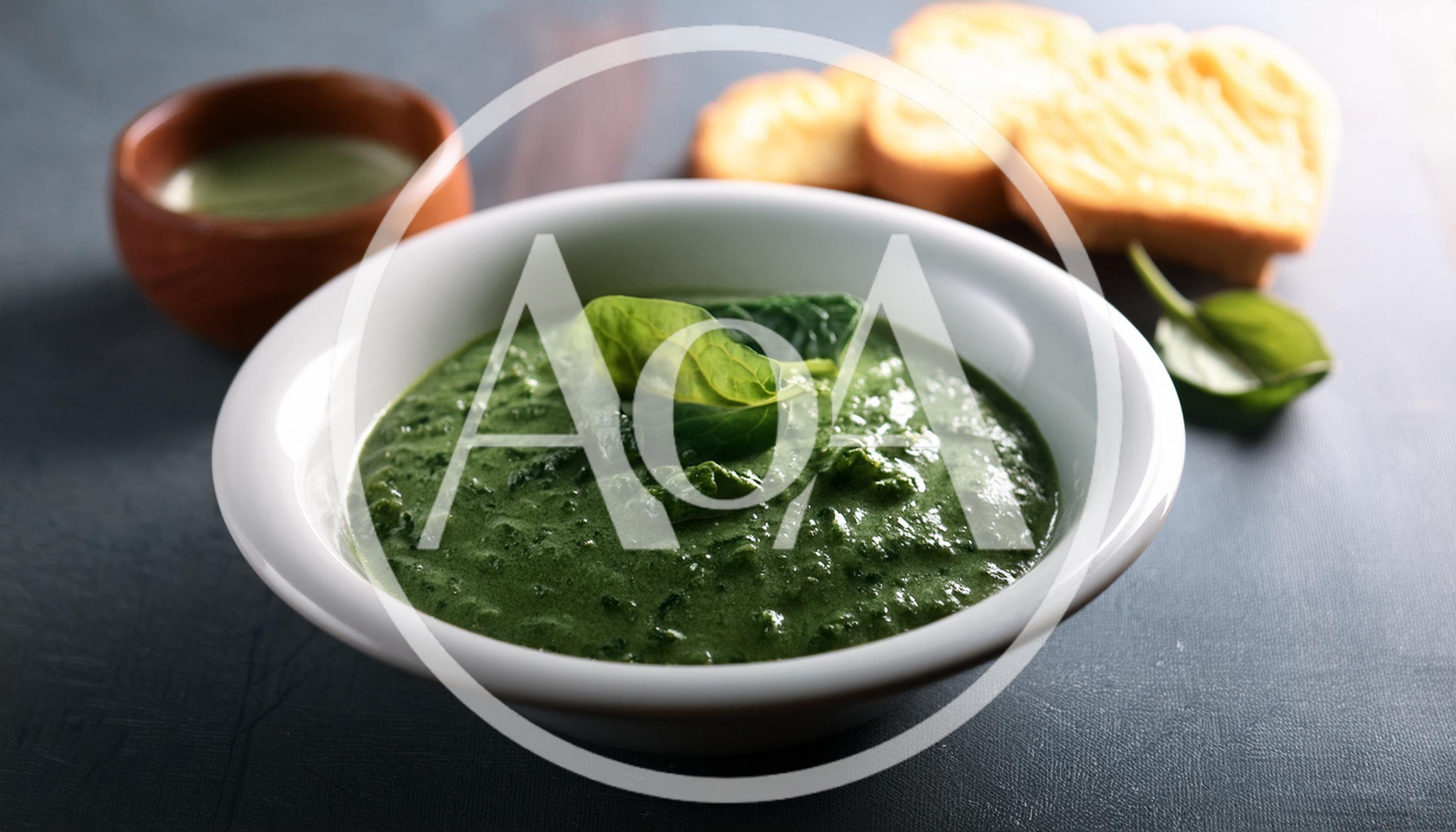 Bowl Of Creamy Spinach Soup With Toasted Bread