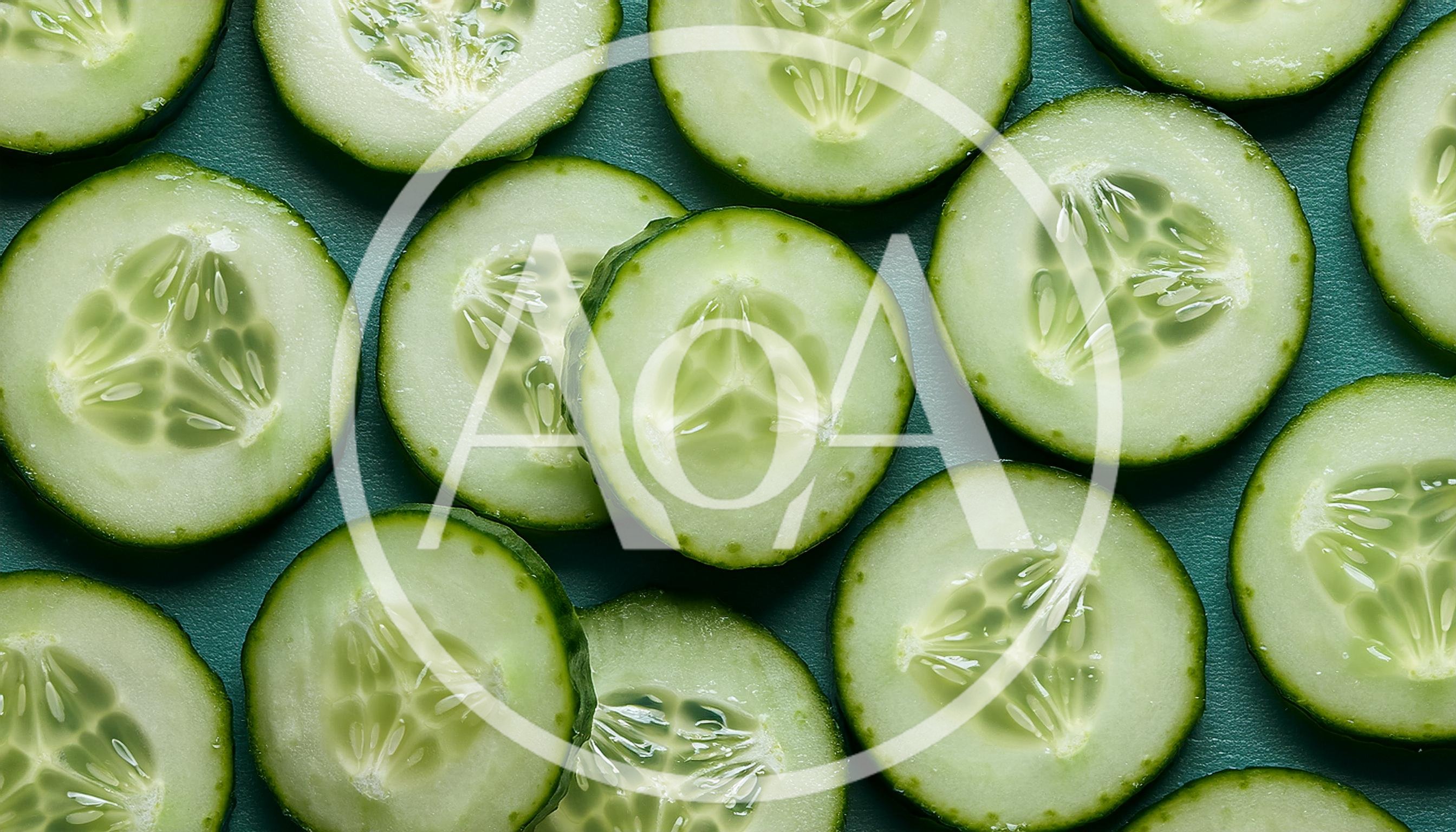 Fresh Sliced Cucumber Rounds On Dark Green Background