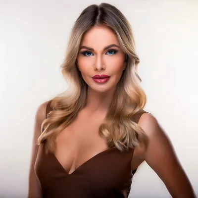 Portrait Of A Beautiful Blonde Woman In Brown Dress