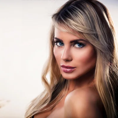 Portrait Of A Beautiful Blonde Woman With Blue Eyes