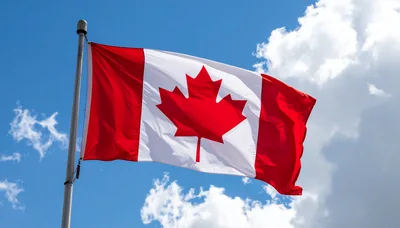 Canadian Flag Waving Against A Blue Sky