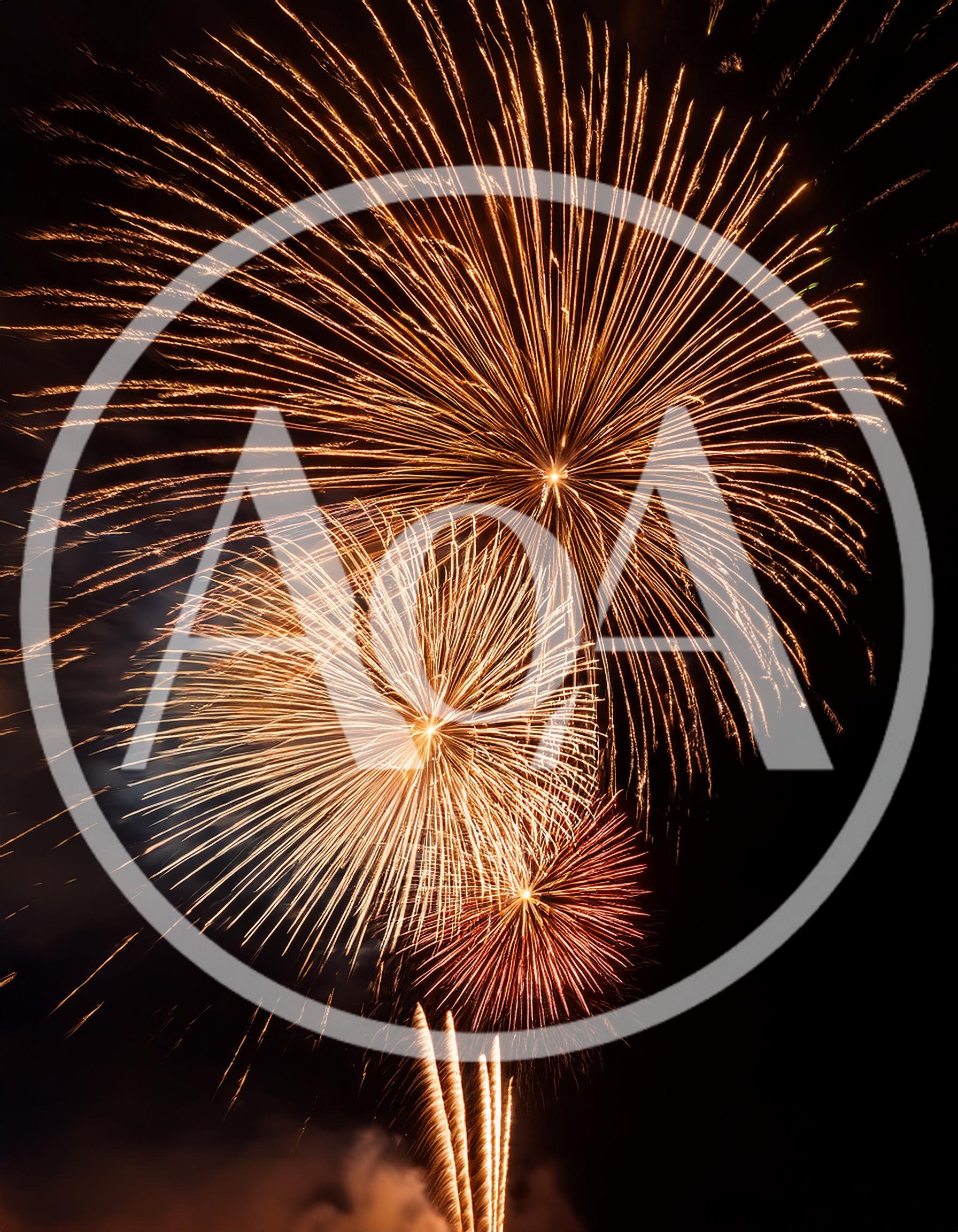 Golden Fireworks Display Against Dark Night Sky