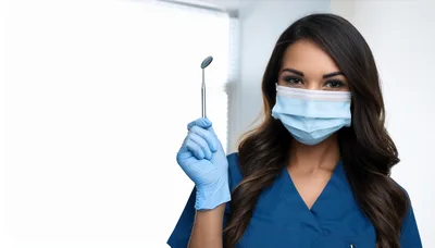 Female Dentist Holding Dental Mirror In Clinic