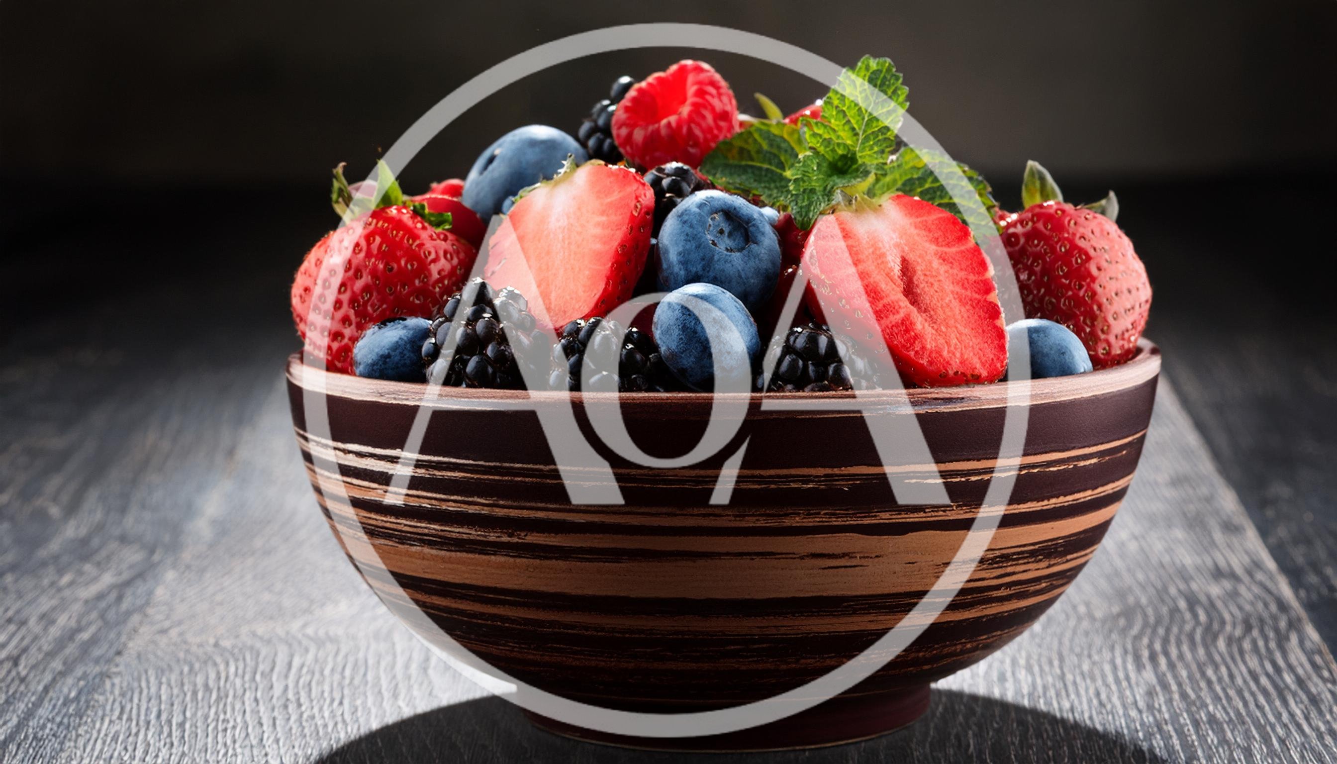 Fresh Mixed Berries In A Ceramic Bowl