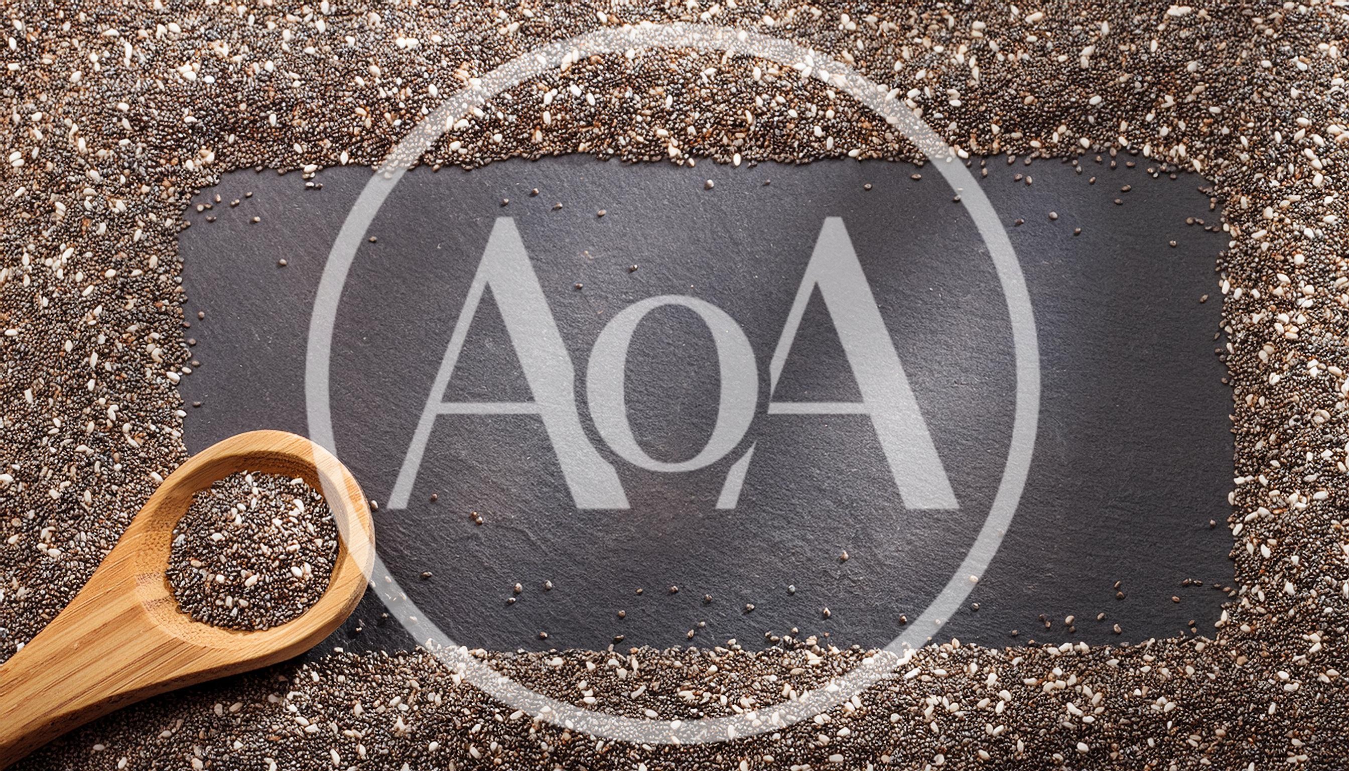 Chia Seeds On A Slate Background With Wooden Spoon