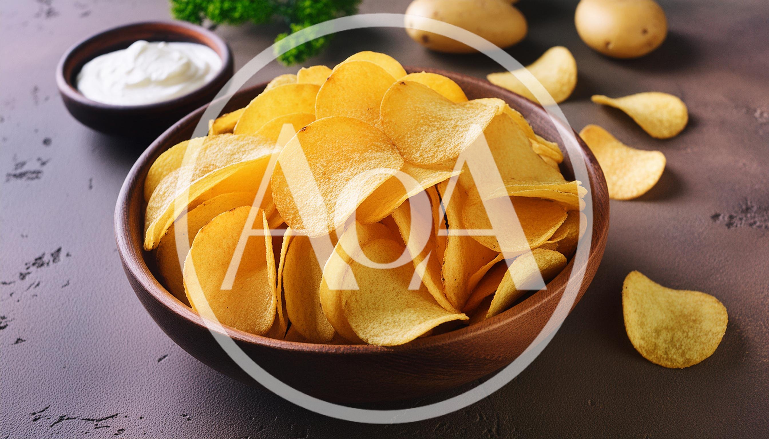 Bowl Of Crispy Potato Chips With Sour Cream Dip