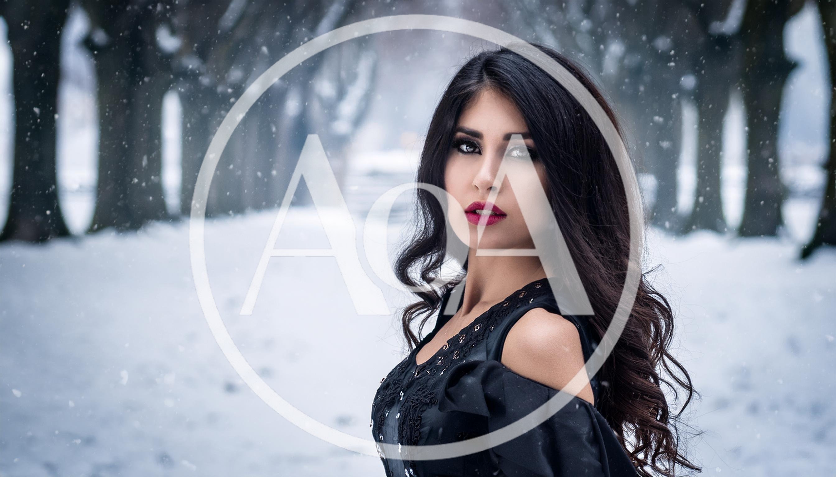 Portrait Of A Beautiful Woman In A Snowy Forest