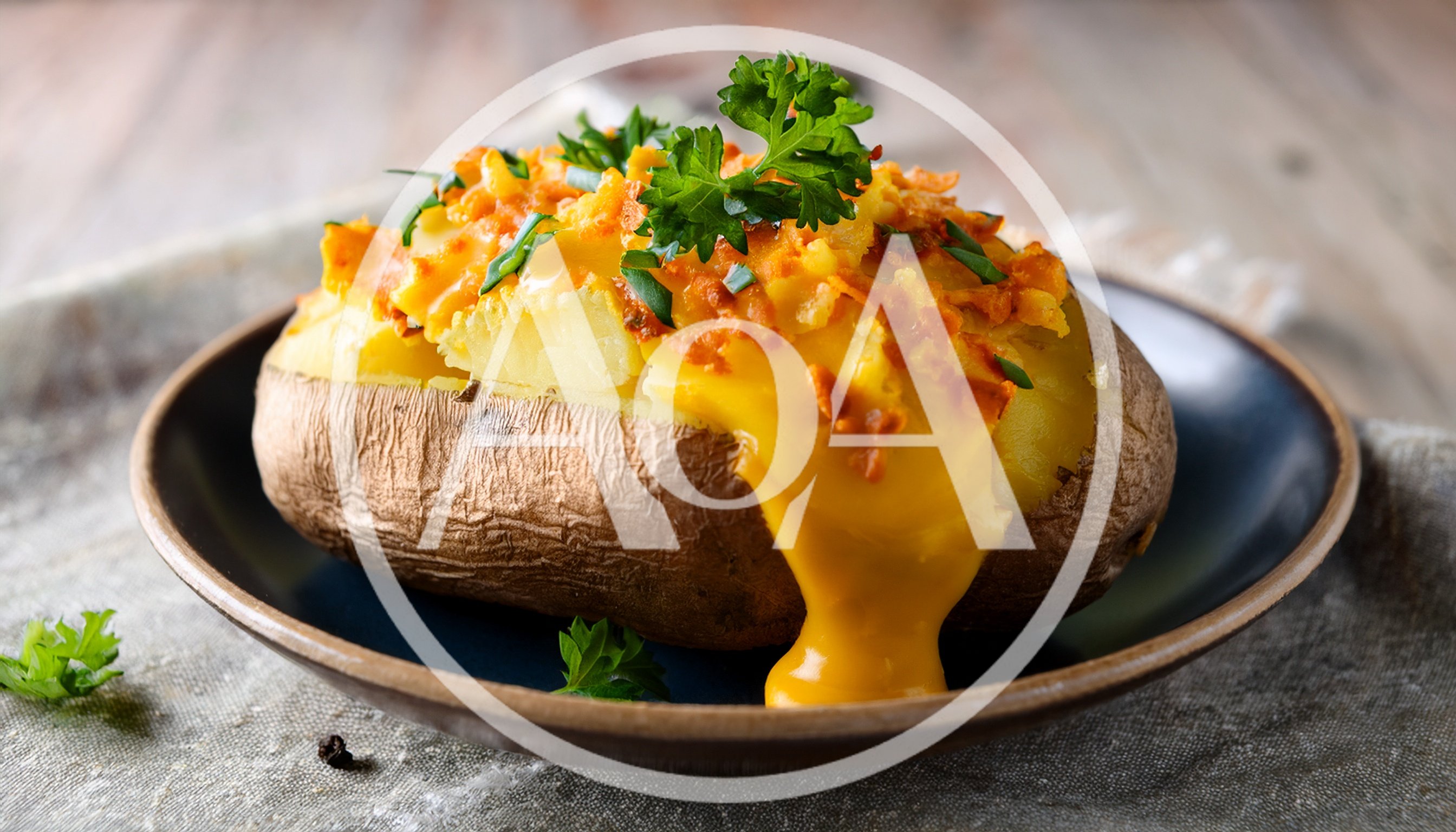 Baked Potato Topped With Melted Cheddar Cheese
