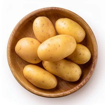 Fresh Raw Potatoes In A Wooden Bowl