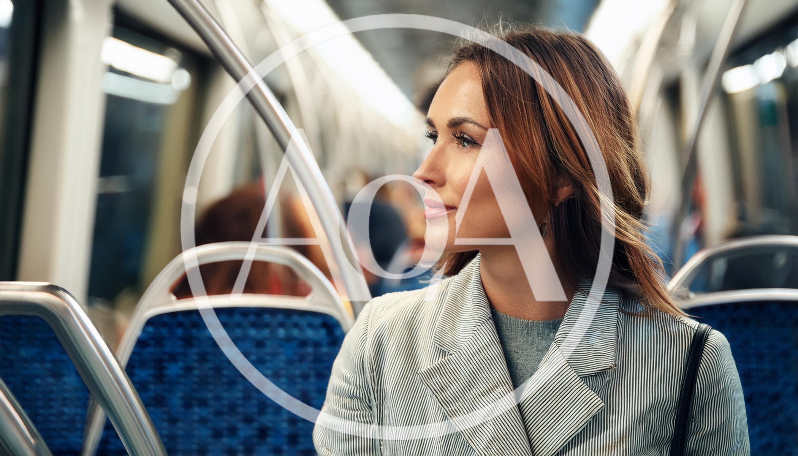 Young Woman Commuting On A Public Transit Train