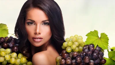 Beautiful Woman Posing With Fresh Green And Purple Grapes