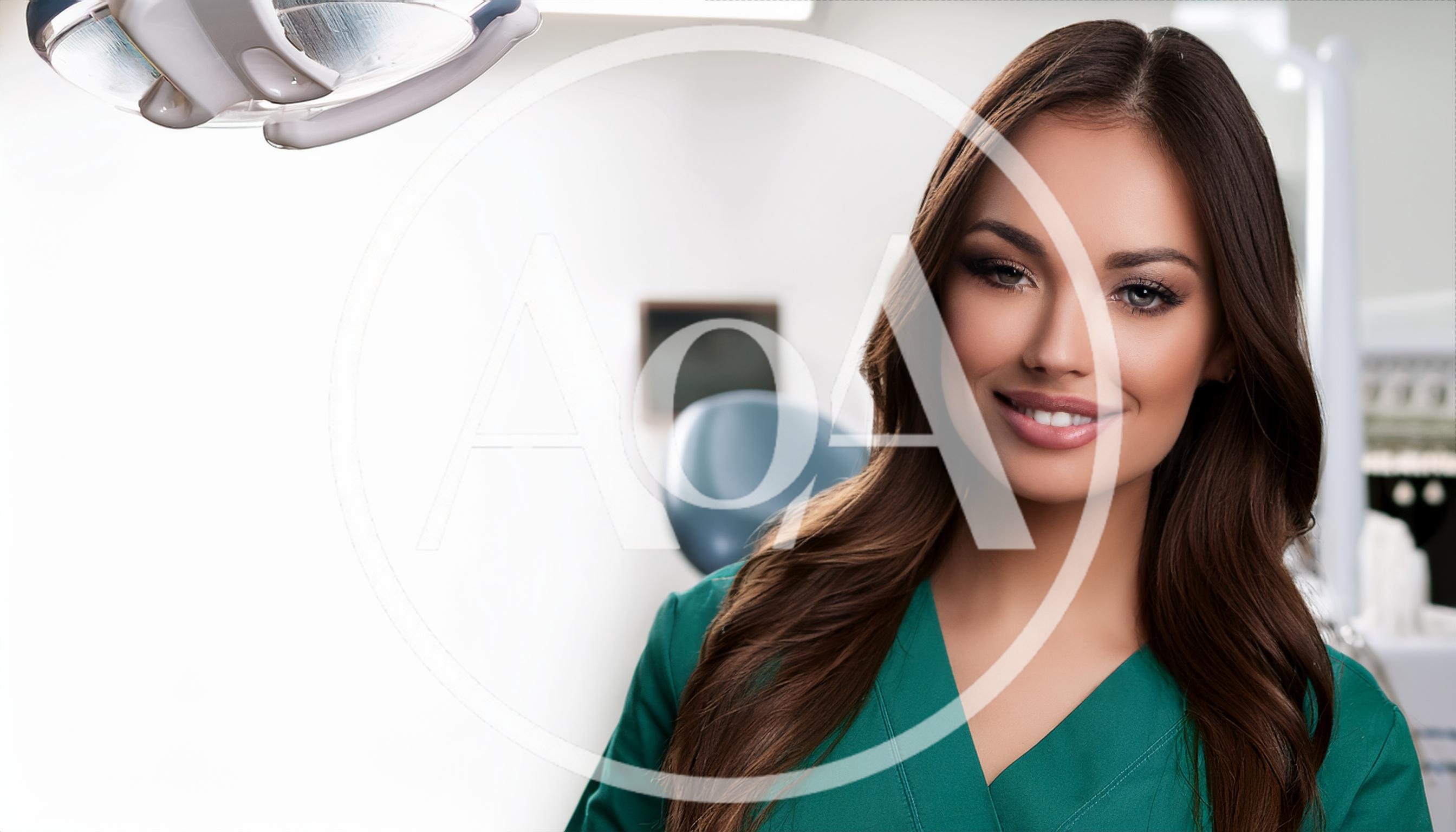 Portrait Of A Professional Female Dentist In Clinic