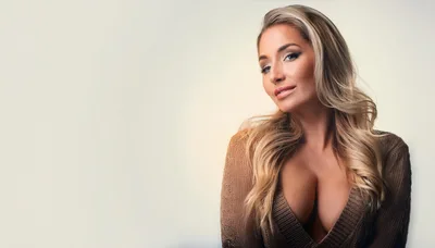 Portrait Of A Beautiful Blonde Woman In A Sweater