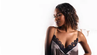 Beautiful Young Woman Posing In Silk Lingerie