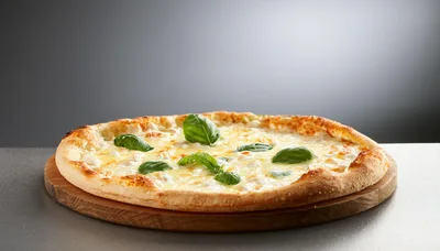 Freshly Baked Four Cheese Pizza With Basil Leaves