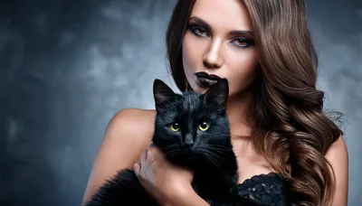 Beautiful Woman Holding A Black Cat