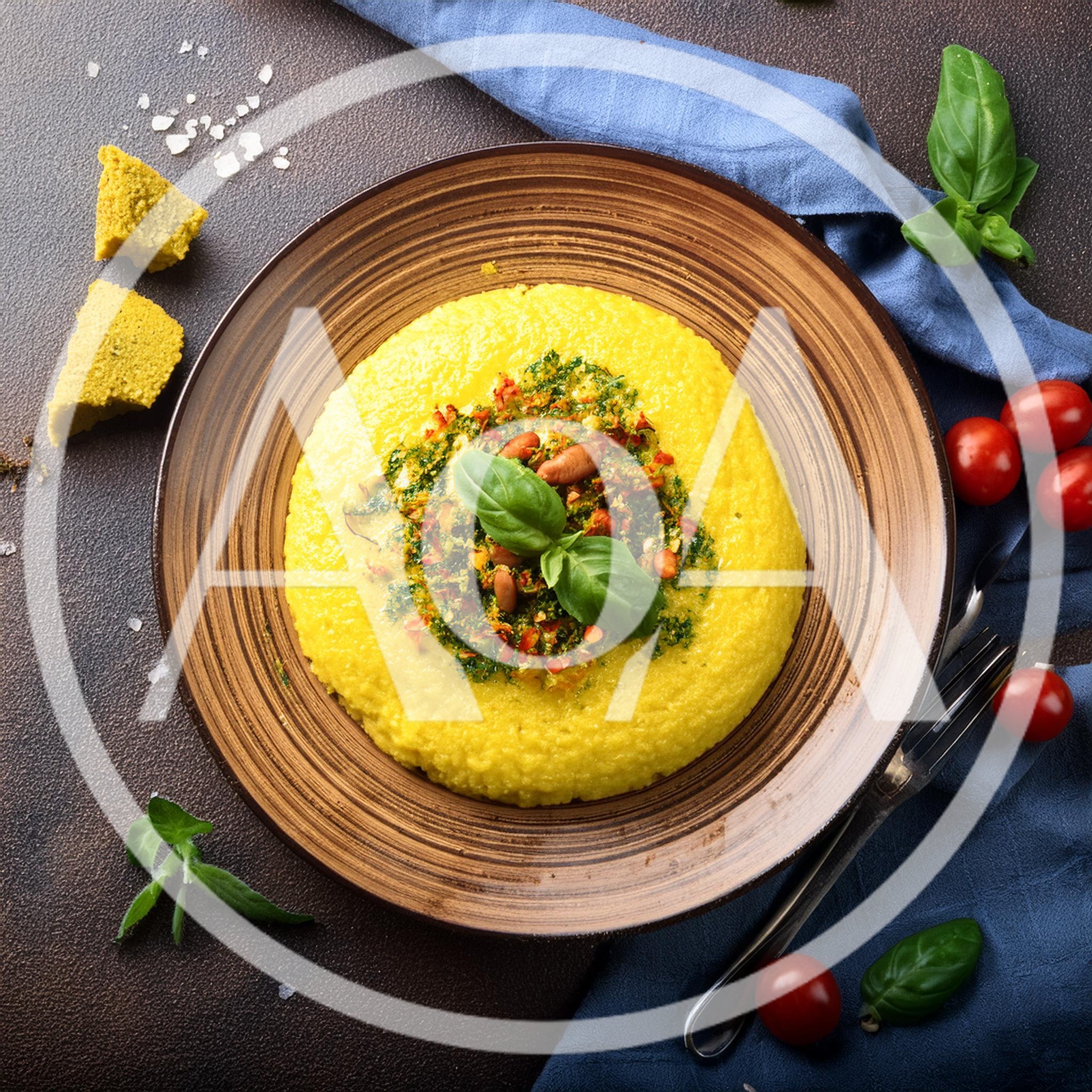 Polenta With Pesto And Pine Nuts On A Plate