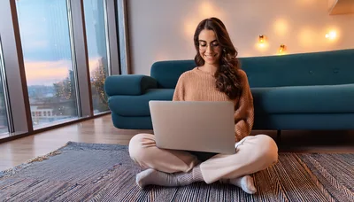 Young Woman Working On Laptop At Home