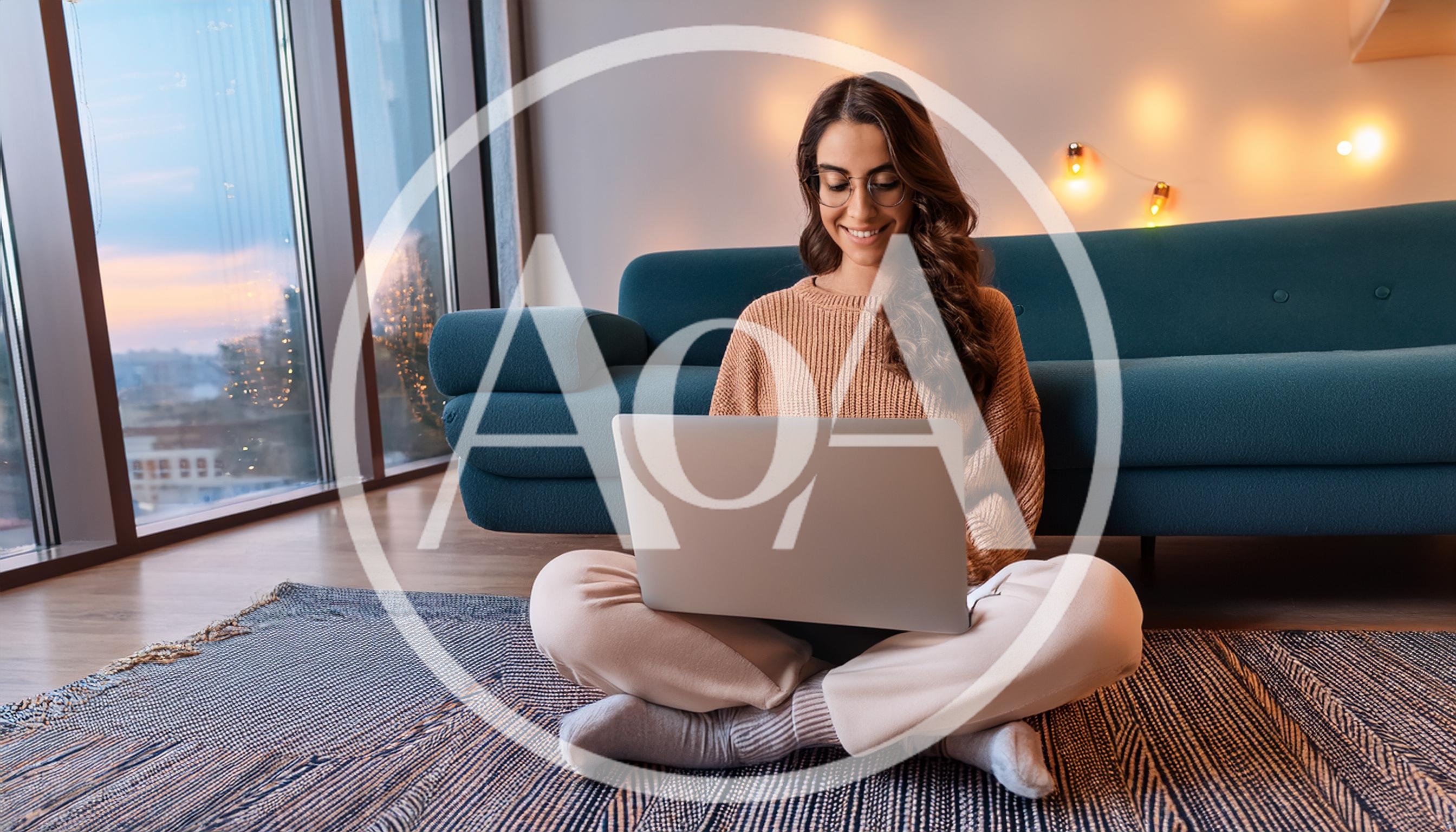 Young Woman Working On Laptop At Home