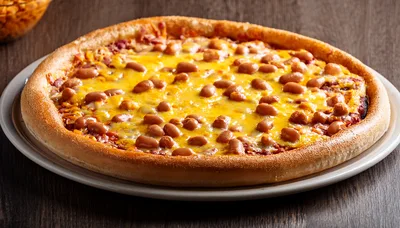 Baked Bean Pizza On A White Plate