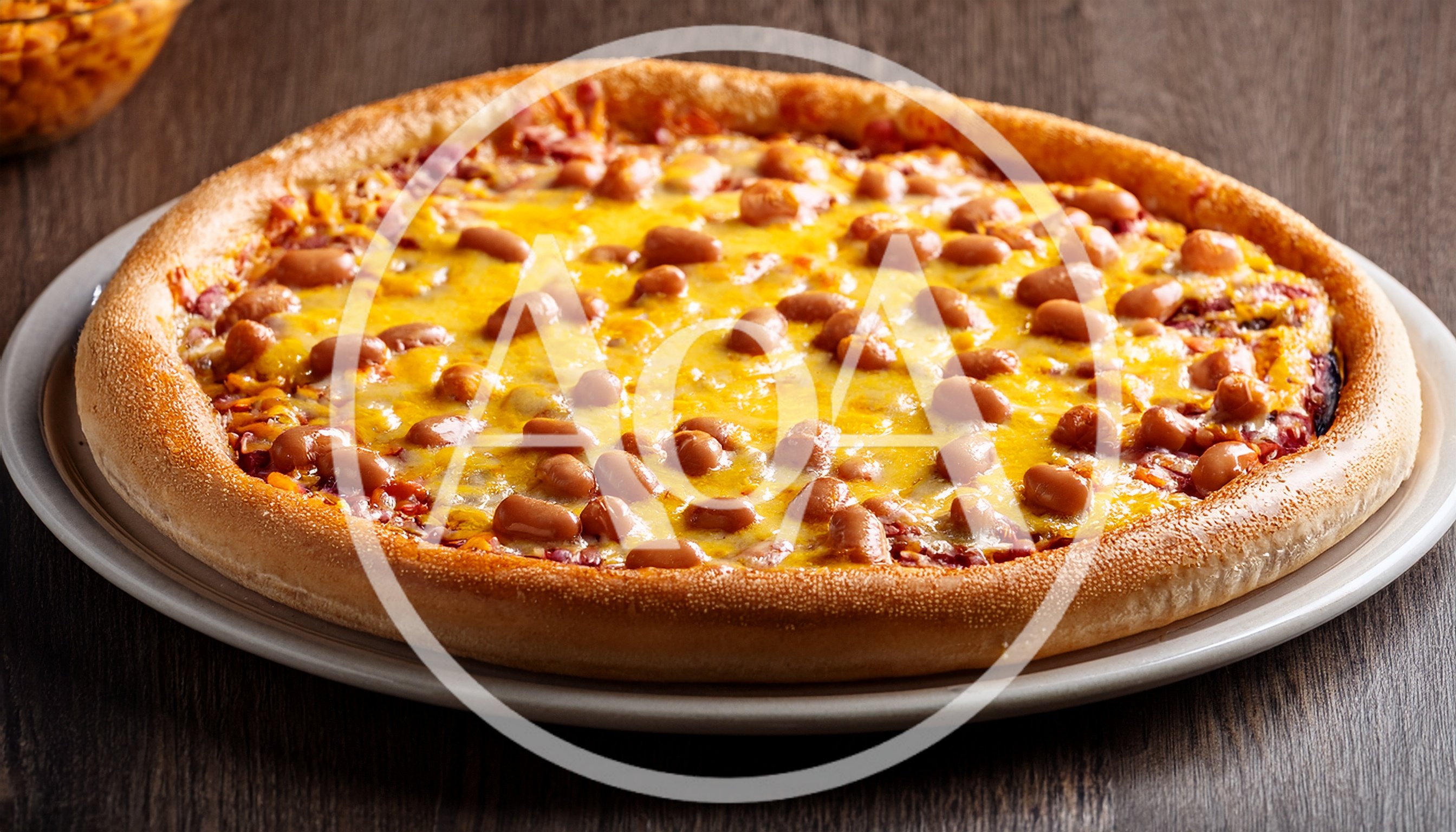 Baked Bean Pizza On A White Plate
