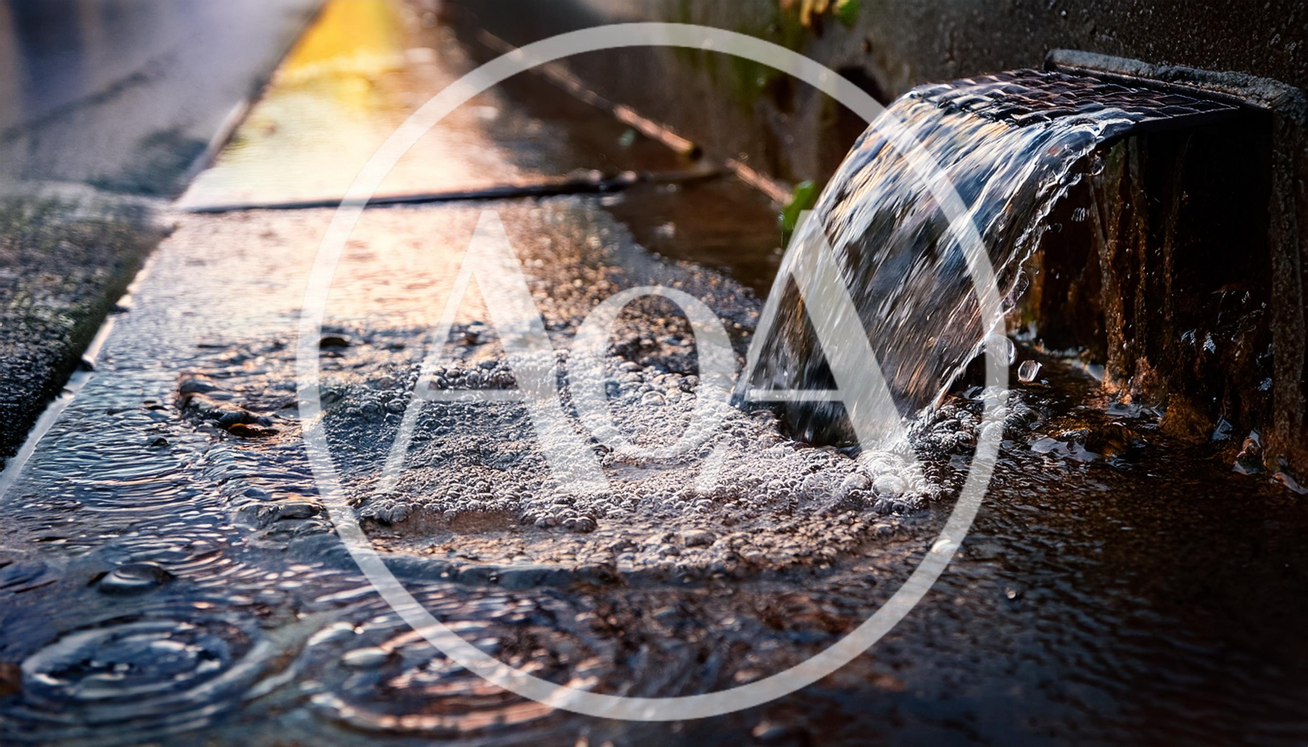 Water Flowing From A Concrete Drainage Pipe