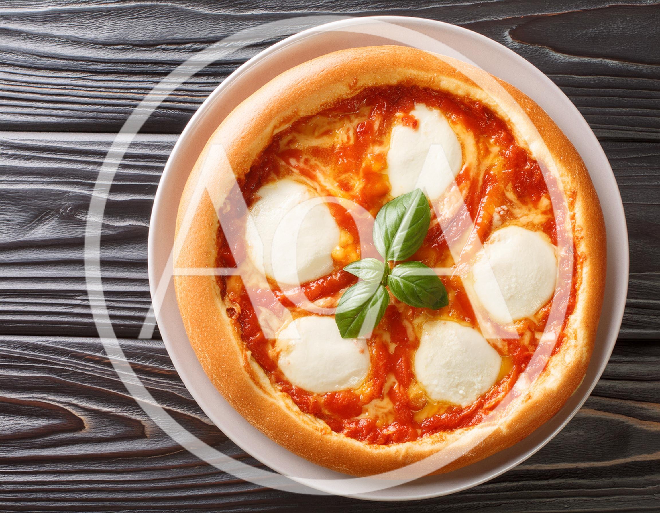 Fresh Margherita Pizza On A Dark Wooden Table