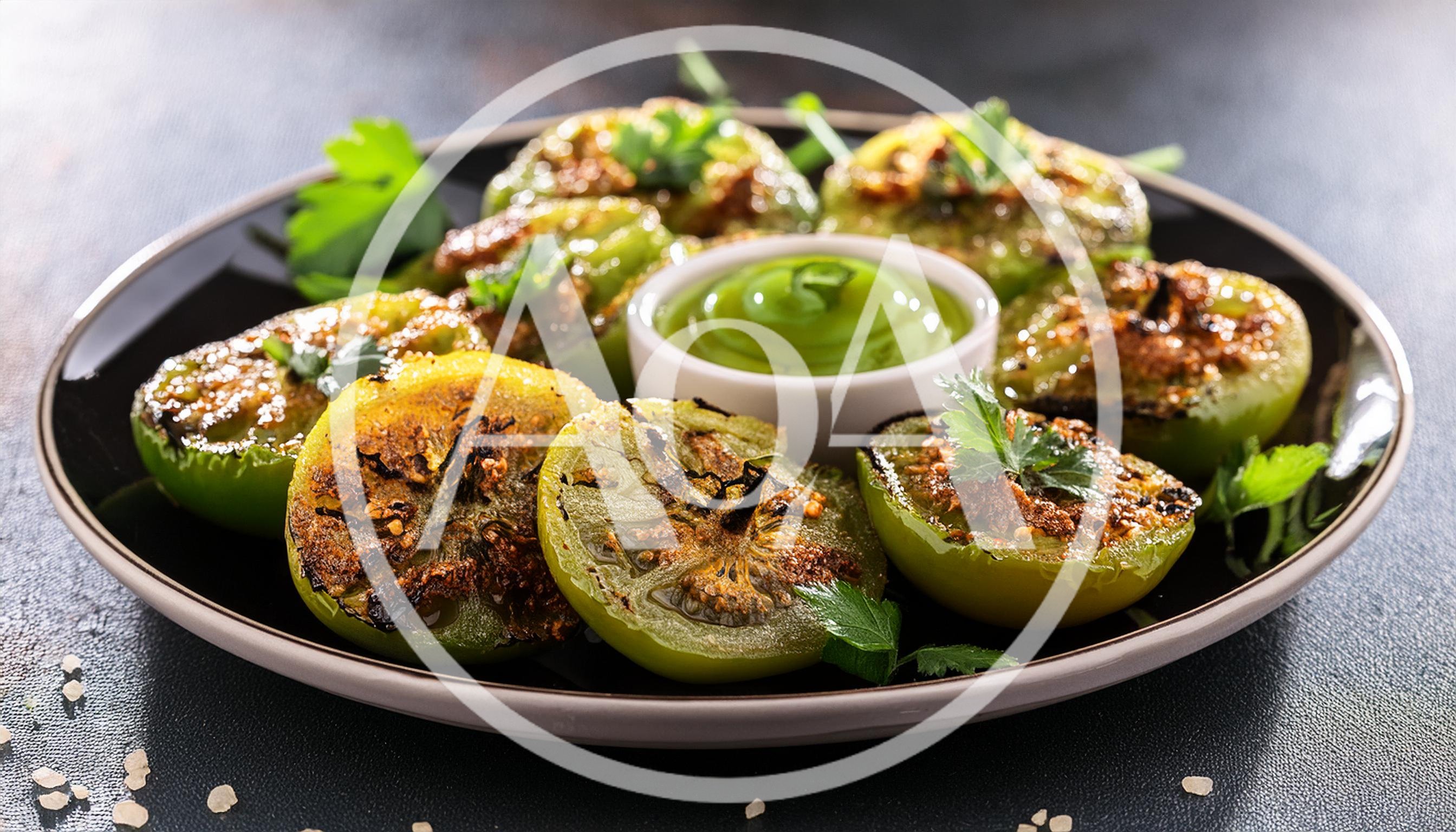 Grilled Green Tomatoes With Herb Sauce On Plate