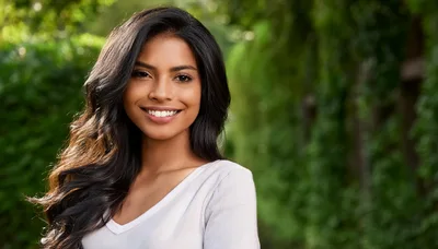 Portrait Of A Smiling Young Woman Outdoors