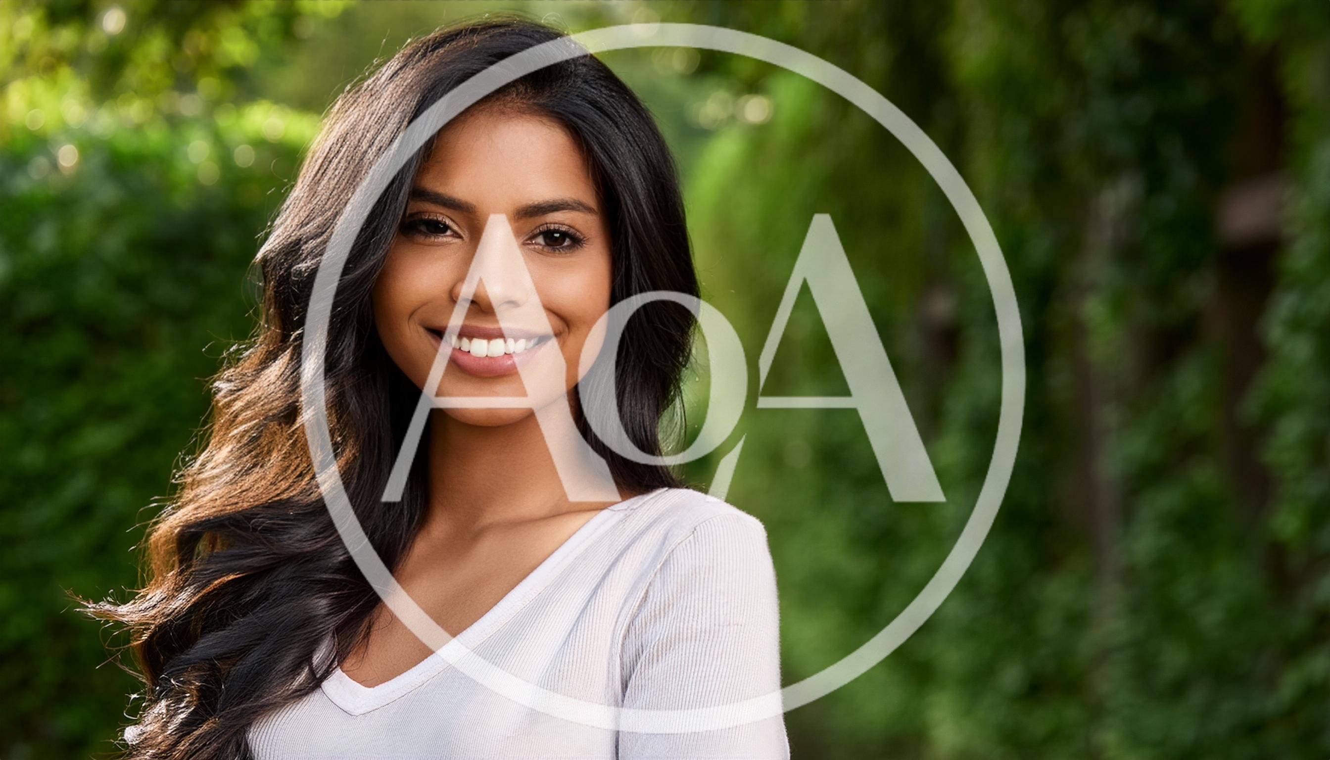 Portrait Of A Smiling Young Woman Outdoors