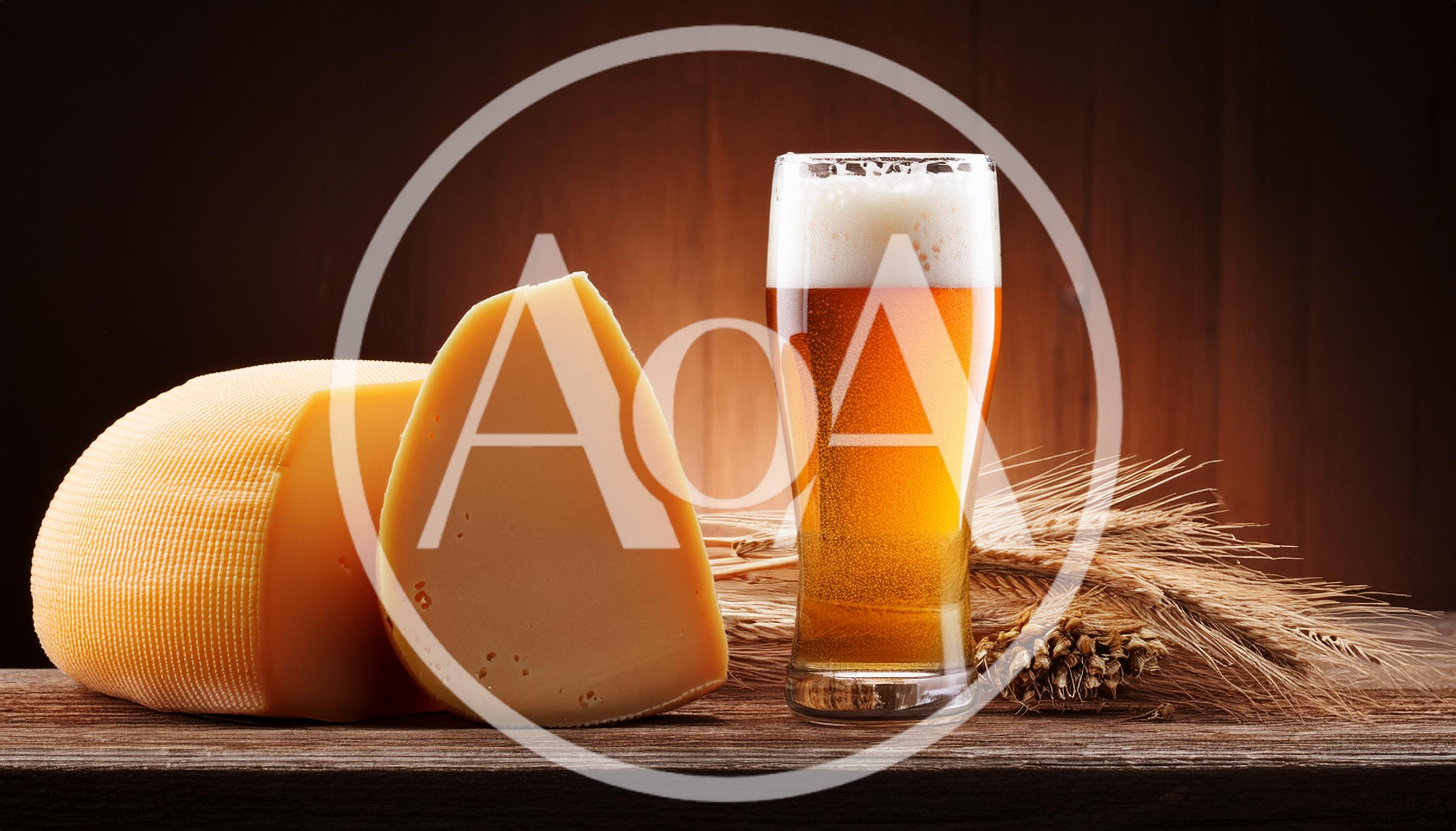 Glass Of Beer With Cheese And Wheat Stalks