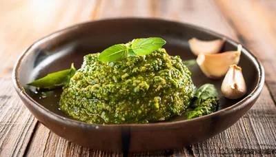 Fresh Green Pesto Sauce in a Rustic Bowl