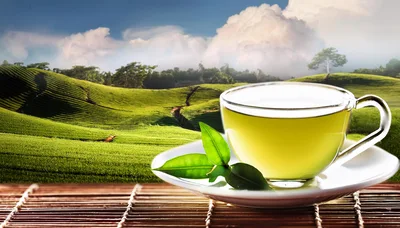 Glass Cup Of Green Tea On A Bamboo Mat