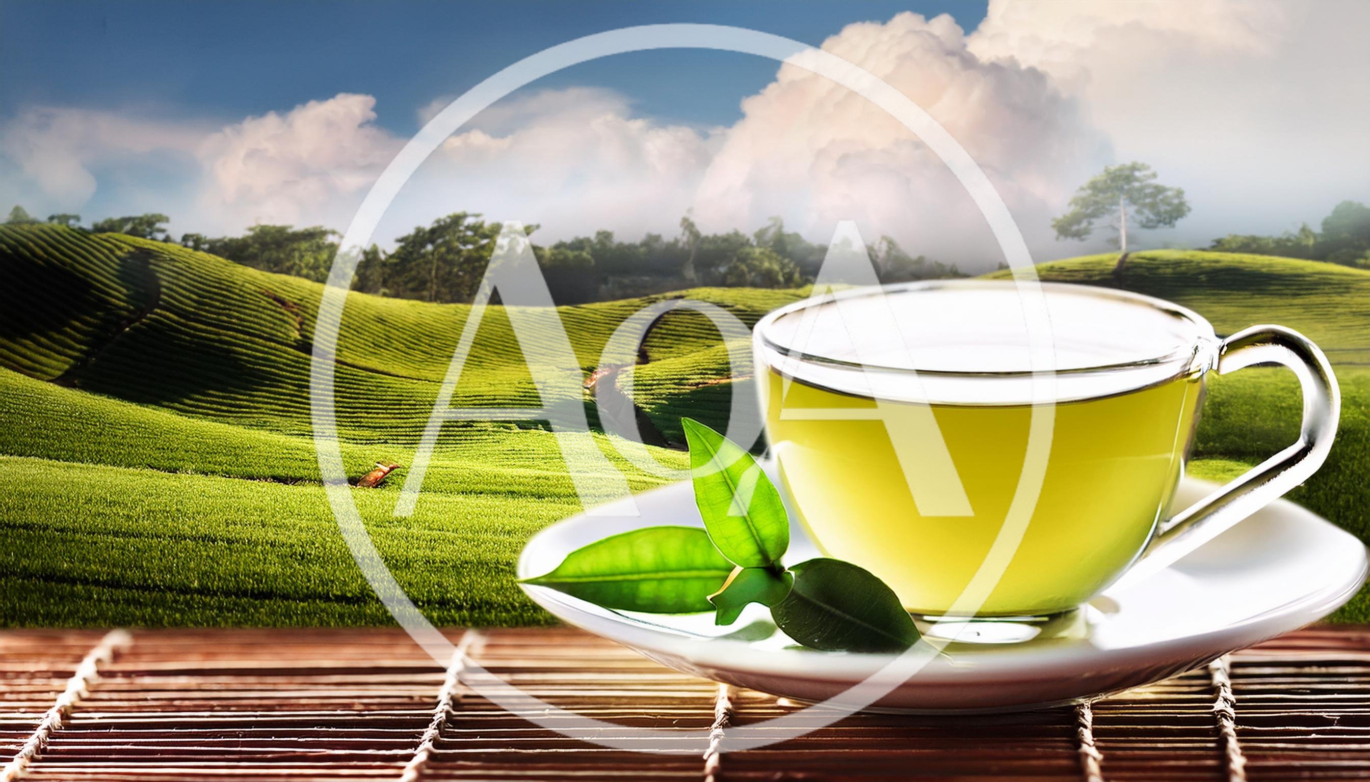 Glass Cup Of Green Tea On A Bamboo Mat