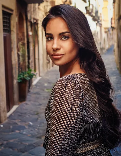 Young Woman Looking Back In A Narrow European Alley