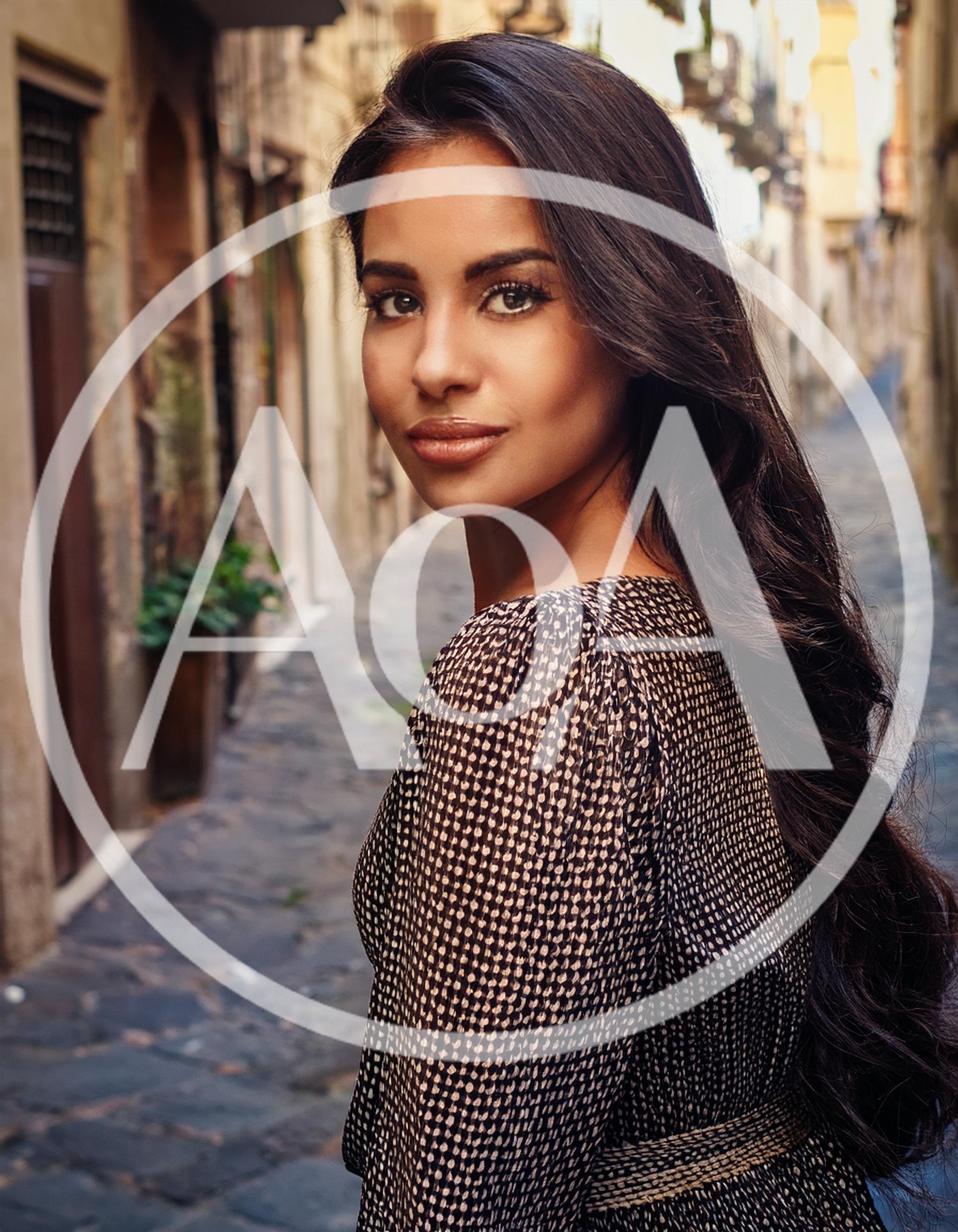 Young Woman Looking Back In A Narrow European Alley