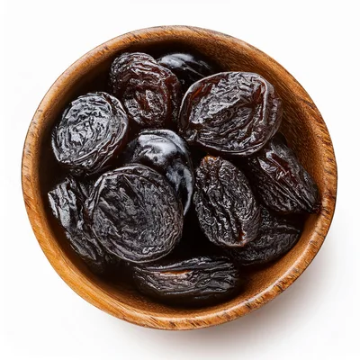 Dried Prunes In A Wooden Bowl