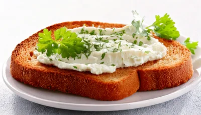 Toasted Bread Slice With Cream Cheese And Fresh Parsley