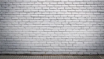 White Painted Brick Wall With Paved Ground