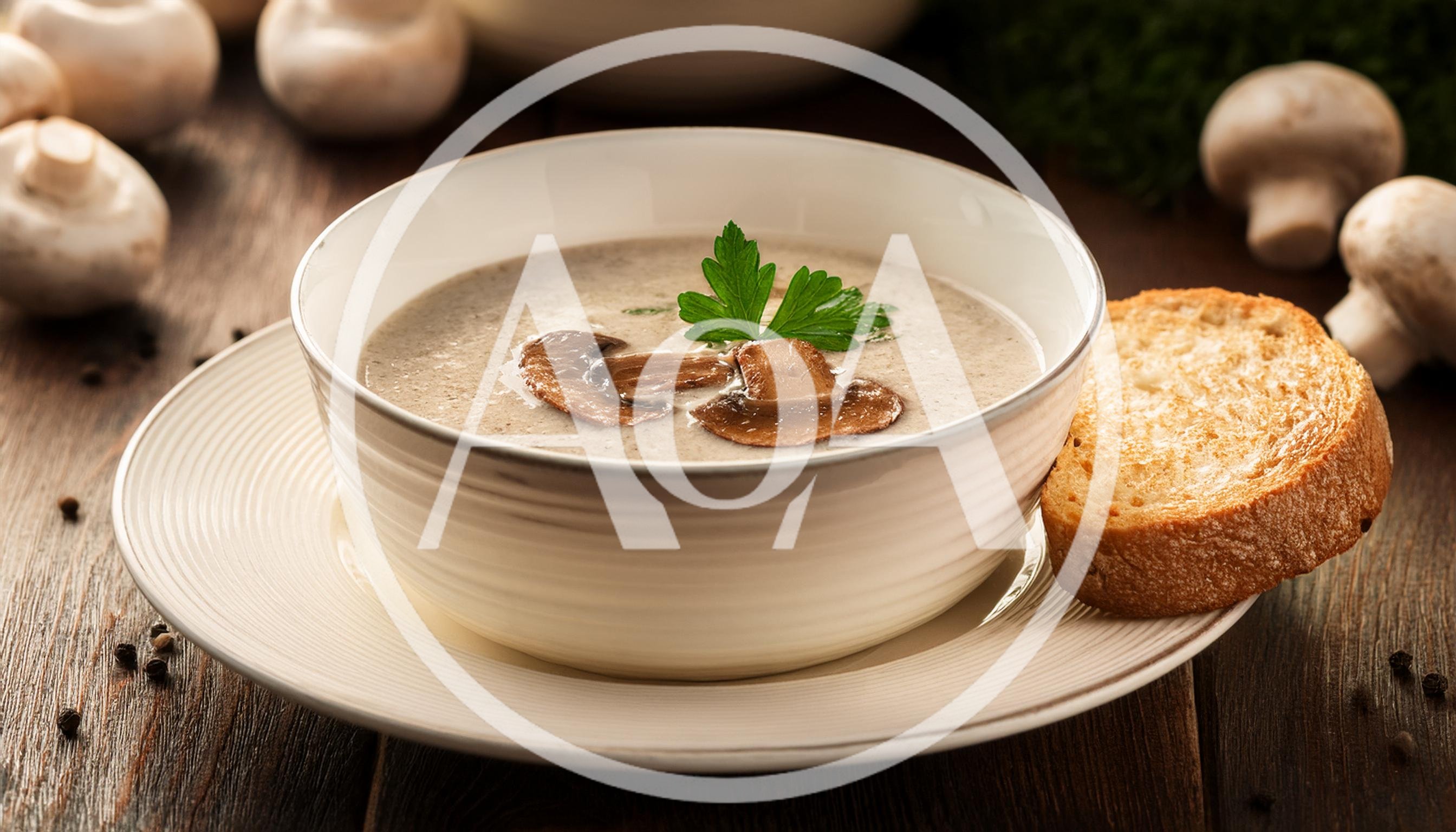 Creamy Mushroom Soup Served In A White Bowl