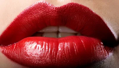 Extreme Close Up Of Woman Wearing Red Lipstick