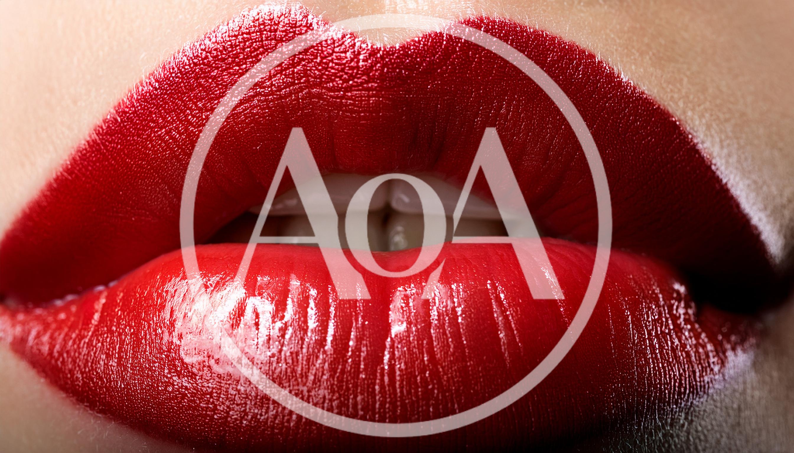 Extreme Close Up Of Woman Wearing Red Lipstick