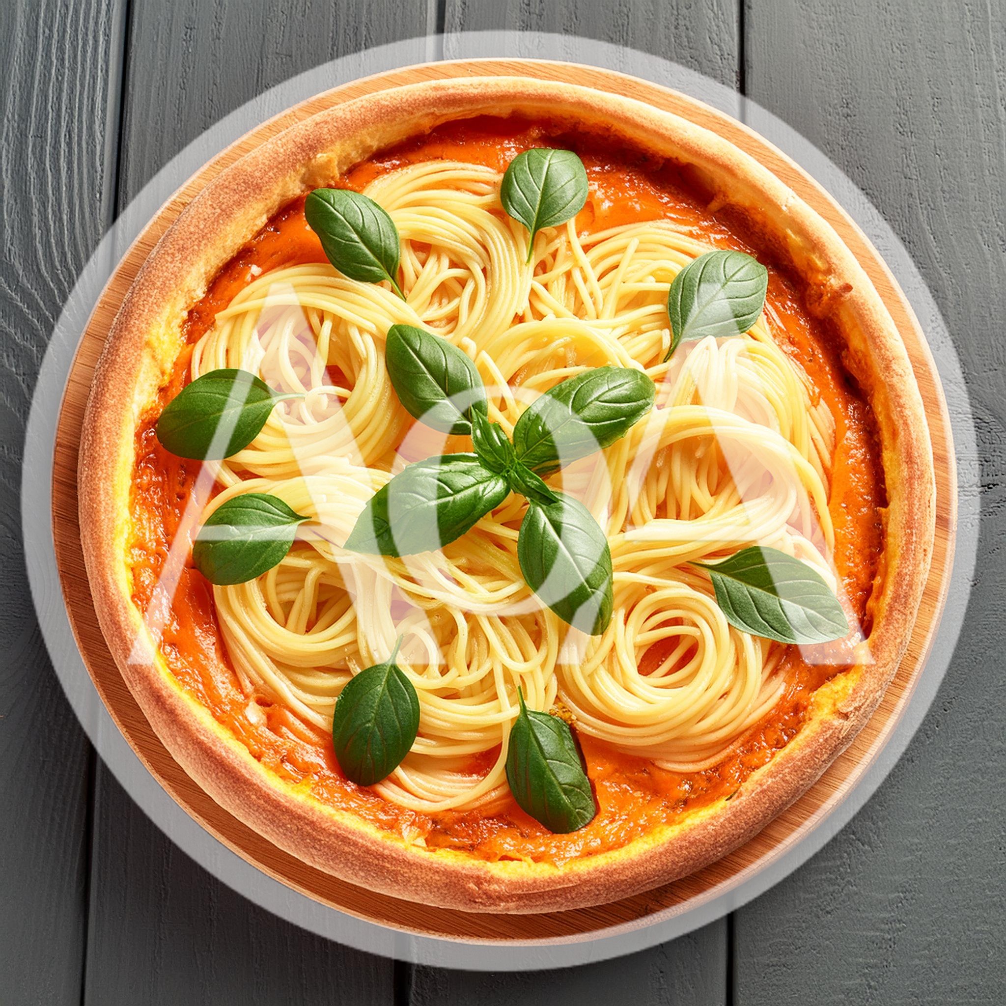 Spaghetti Pizza Topped With Fresh Basil Leaves