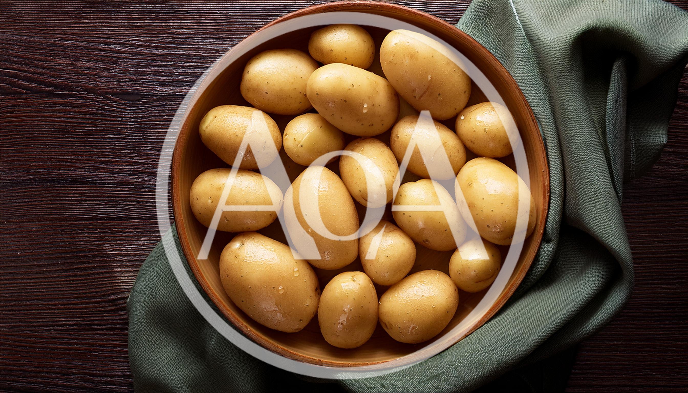 Fresh Raw Potatoes In A Wooden Bowl