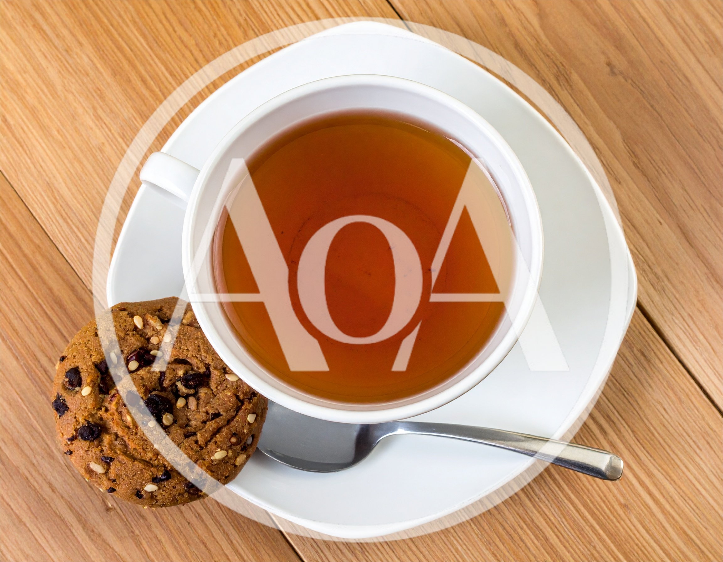Cup Of Tea With A Cookie On A Wooden Table