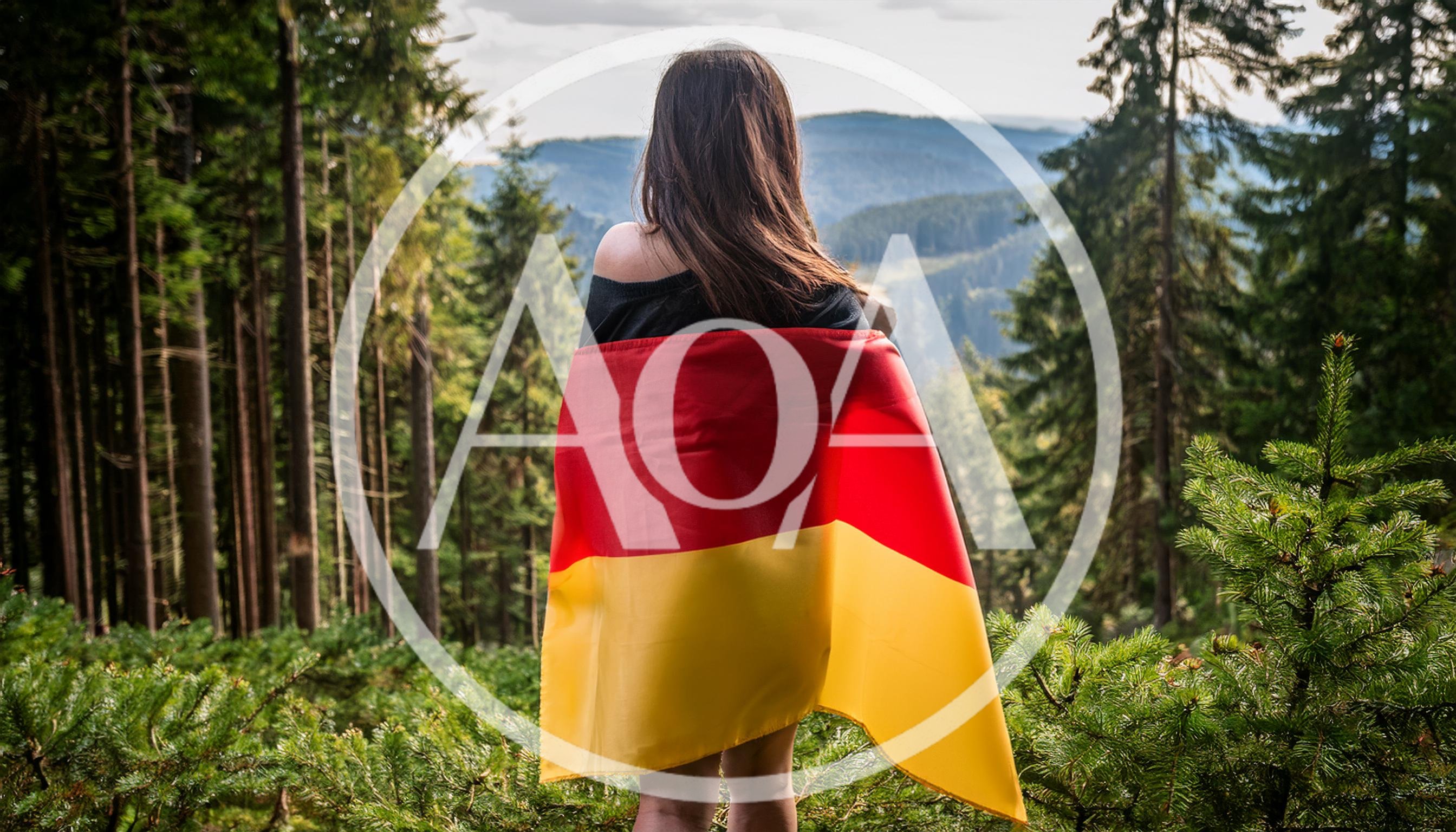 Woman Standing In Forest Wrapped In German Flag